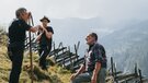 Drei Männer stehen mit ihren Sensen beieinander | © TVB Wipptal | Johannes Bitter